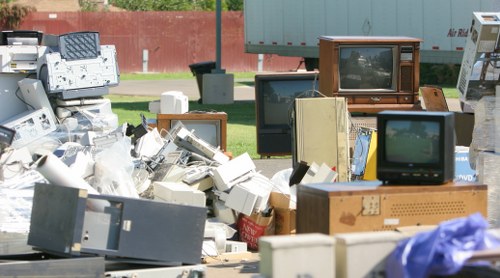 Volunteers loading reusable furniture destined for charity reuse